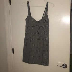 Black and white polka-dotted fitted mini dress